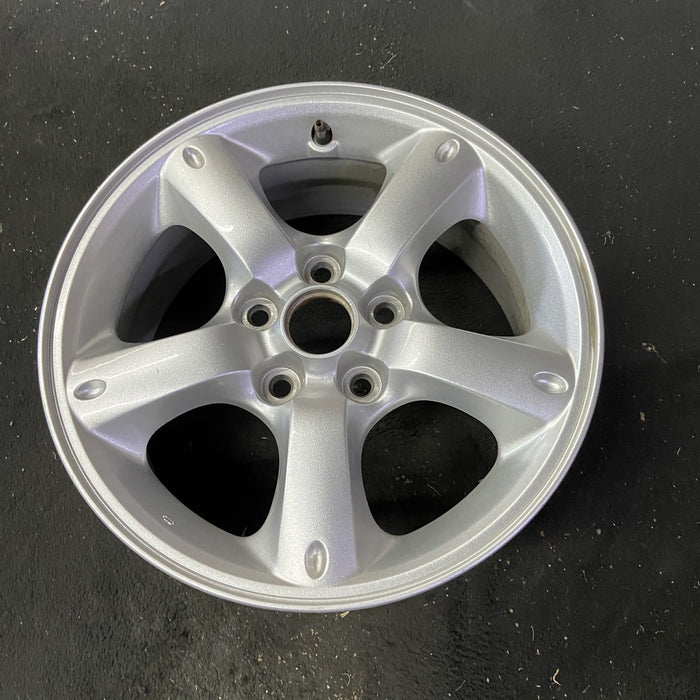 16" MAZDA TRIBUTE 05-06 16x7, , oval dimples ends Original OEM Wheel Rim - Close-Up Detail