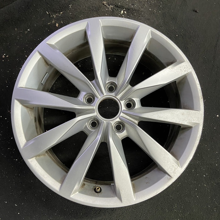 17" GOLF 17 17x7 , 10 spoke, 49mm offset, silver pockets Original OEM Wheel Rim - Angle View