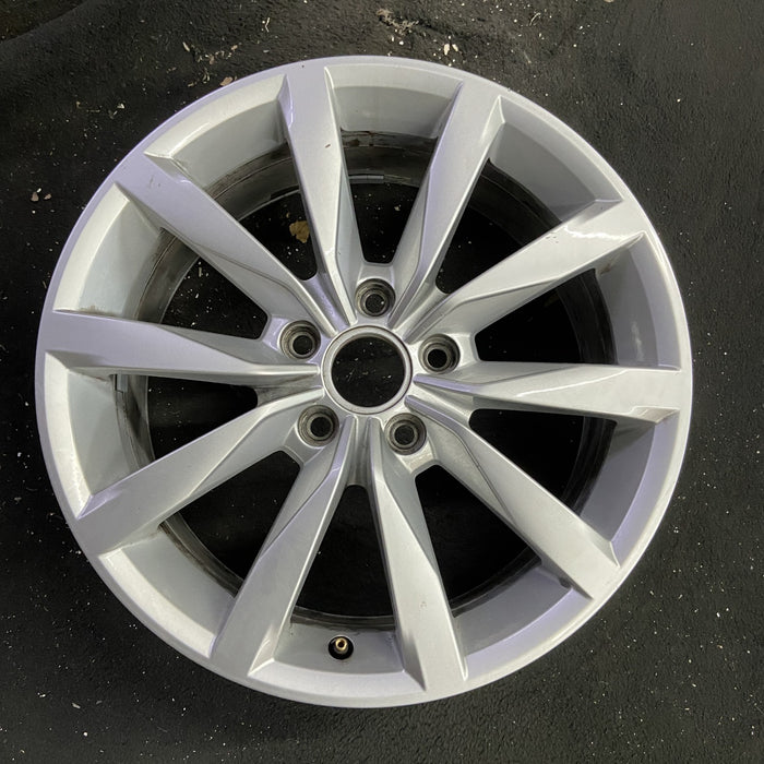 17" GOLF 17 17x7 , 10 spoke, 49mm offset, silver pockets Original OEM Wheel Rim - Angle View