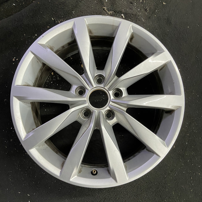 17" GOLF 17 17x7 , 10 spoke, 49mm offset, silver pockets Original OEM Wheel Rim - Angle View