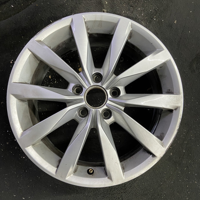 17" GOLF 17 17x7 , 10 spoke, 49mm offset, silver pockets Original OEM Wheel Rim - Angle View