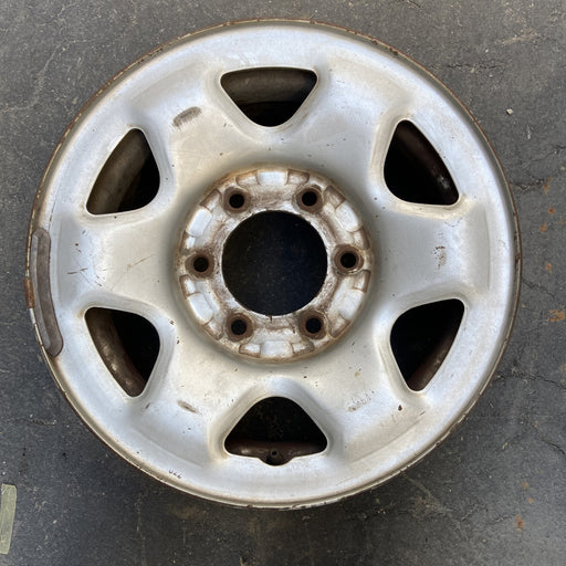 15" FRONTIER 00 4x4, 15x7, steel Original OEM Wheel Rim - Angle View