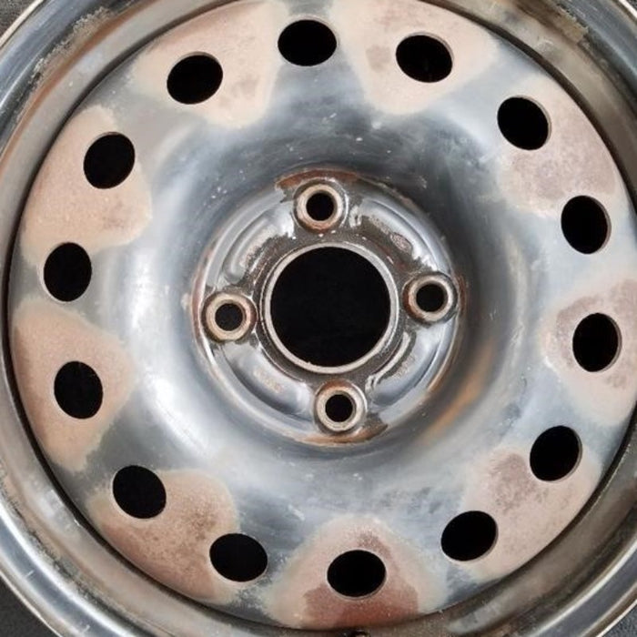 15" FIESTA 11-13 15x6, steel, 14 hole Original OEM Wheel Rim - Angle View