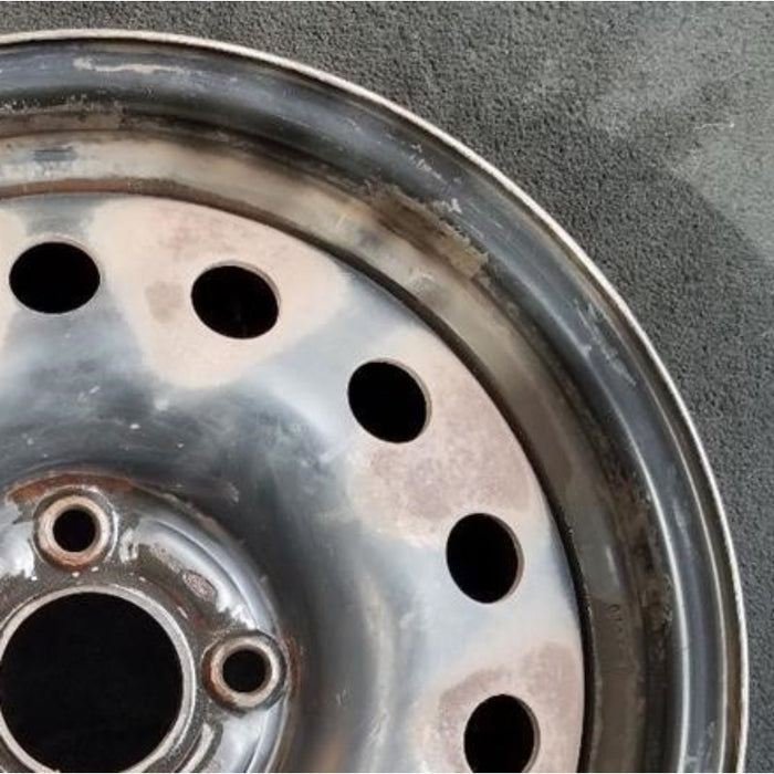 15" FIESTA 11-13 15x6, steel, 14 hole Original OEM Wheel Rim - Close-Up Detail