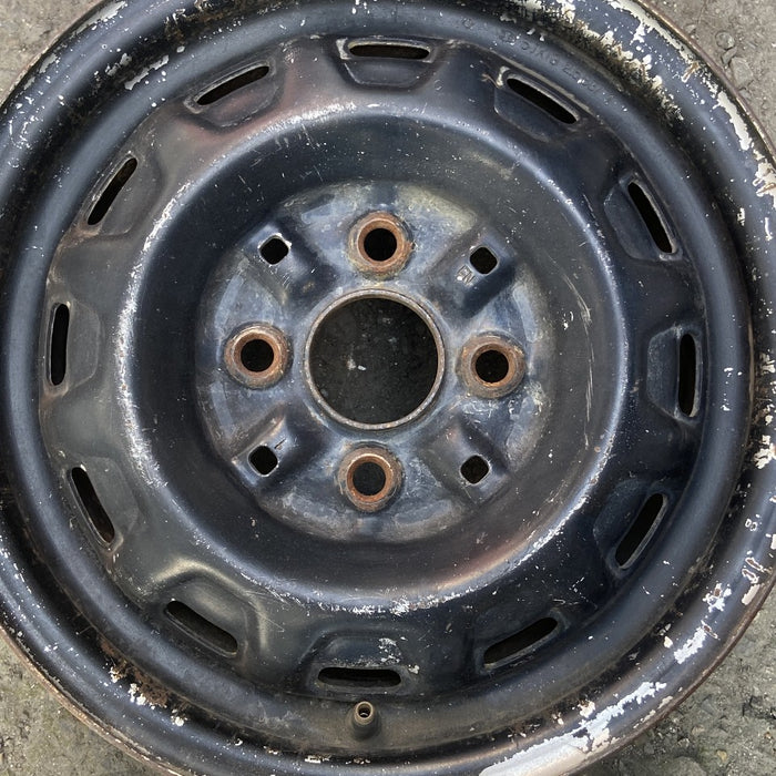 13" COROLLA 86-87 13x5 steel Lftbk 12 hole Original OEM Wheel Rim - Angle View