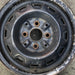 13" COROLLA 86-87 13x5 steel Lftbk 12 hole Original OEM Wheel Rim - Angle View