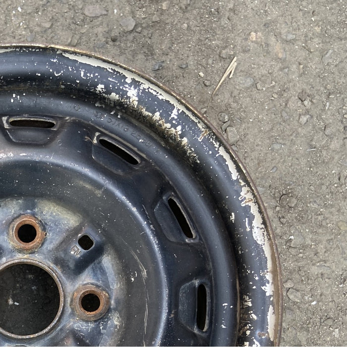 13" COROLLA 86-87 13x5 steel Lftbk 12 hole Original OEM Wheel Rim - Close-Up Detail