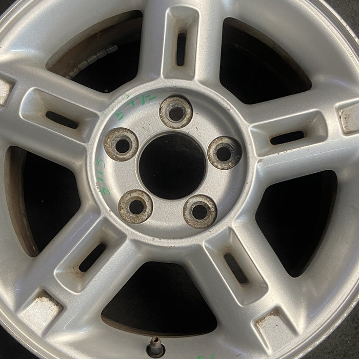 16" EXPLORER 02-03 4 Dr exc. Sport Trac; 16x7 aluminum 5 double spokes w/openings in spokes sparkle silver finish Original OEM Wheel Rim