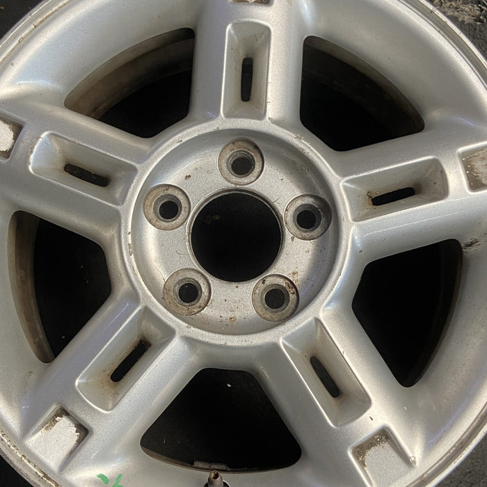 16" EXPLORER 02-03 4 Dr exc. Sport Trac; 16x7 aluminum 5 double spokes w/openings in spokes sparkle silver finish Original OEM Wheel Rim