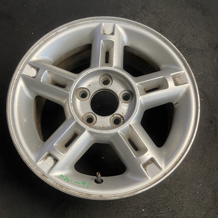 16" EXPLORER 02-03 4 Dr exc. Sport Trac; 16x7 aluminum 5 double spokes w/openings in spokes sparkle silver finish Original OEM Wheel Rim