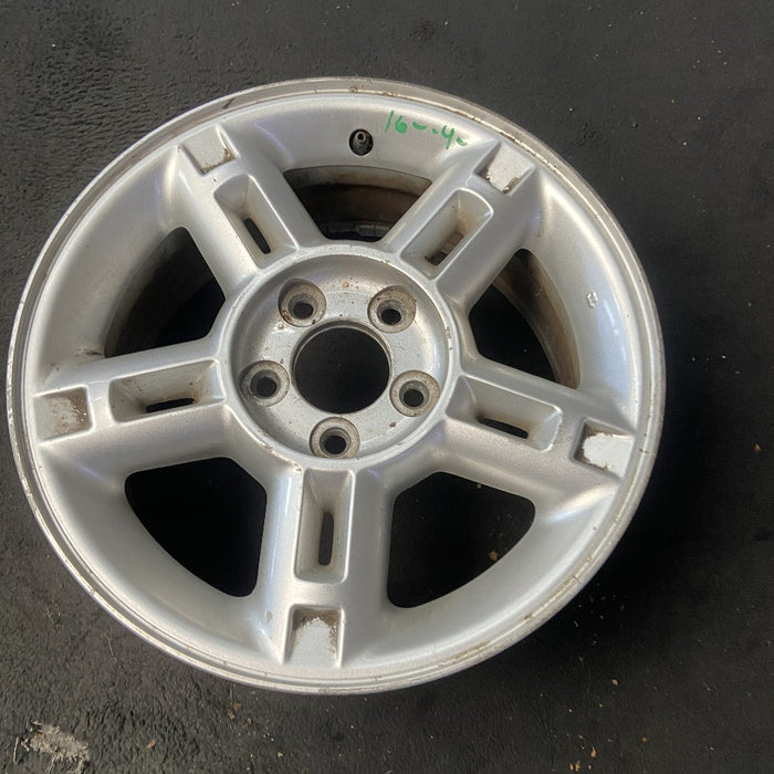 16" EXPLORER 02-03 4 Dr exc. Sport Trac; 16x7 aluminum 5 double spokes w/openings in spokes sparkle silver finish Original OEM Wheel Rim