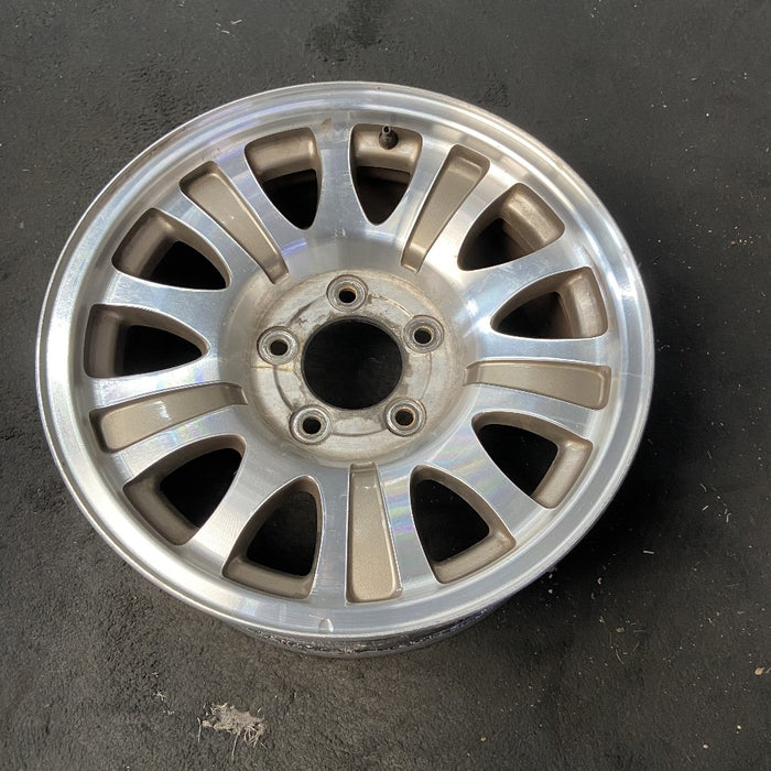 17" EXPEDITION 00 12mm lugs 14mm holes 17x7.5 aluminum 10 triangular holes gold pockets Original OEM Wheel Rim