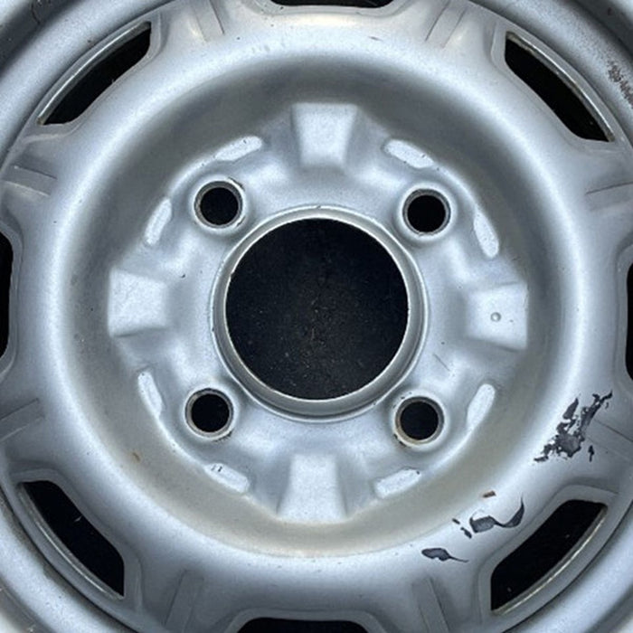 13" 310 79-82 13x4.5, silver colored Original OEM Wheel Rim - Angle View