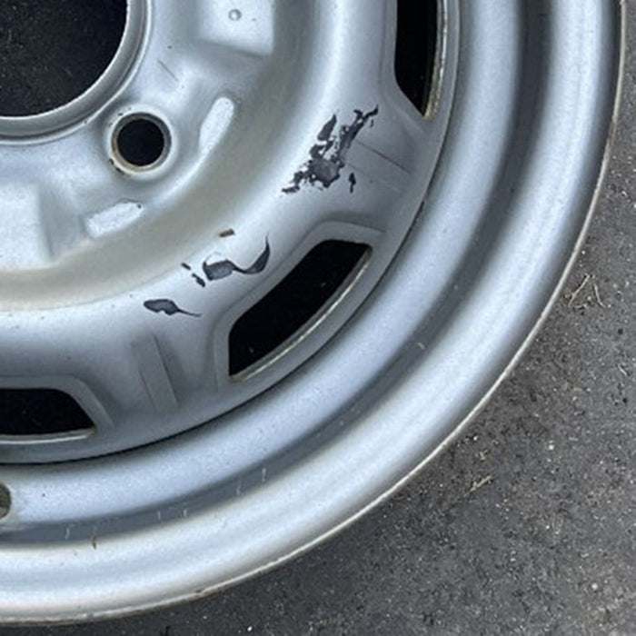13" 310 79-82 13x4.5, silver colored Original OEM Wheel Rim - Back View