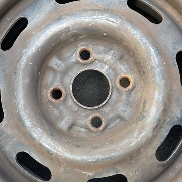 14" ESCORT 97 14x5 , silver Original OEM Wheel Rim - Angle View