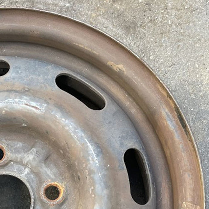 14" ESCORT 97 14x5 , silver Original OEM Wheel Rim - Close-Up Detail