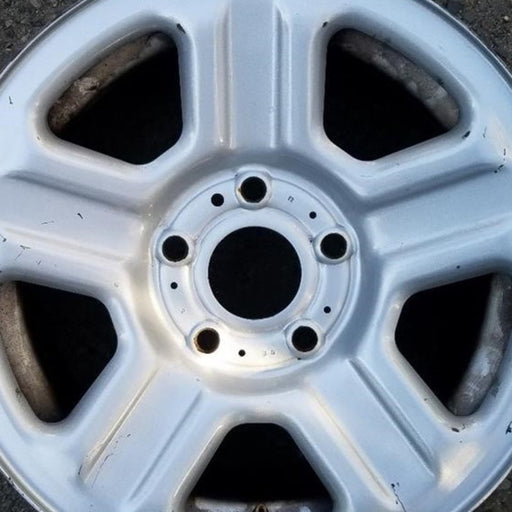 16" WRANGLER 07-10 16x7, steel Original OEM Wheel Rim - Angle View
