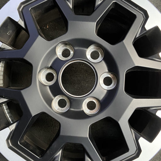 17" TACOMA 24 17x7.5 , black with machined outer lip Original OEM Wheel Rim - Angle View
