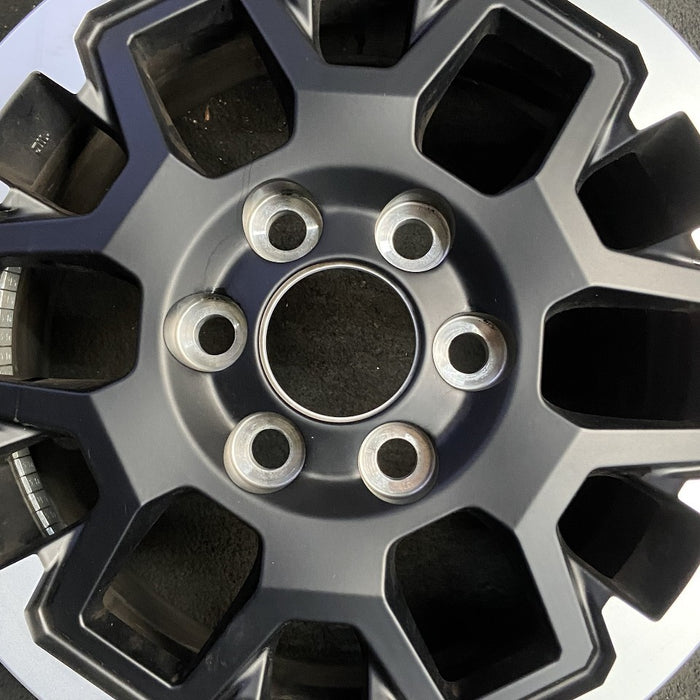 17" TACOMA 24 17x7.5 , black with machined outer lip Original OEM Wheel Rim - Angle View