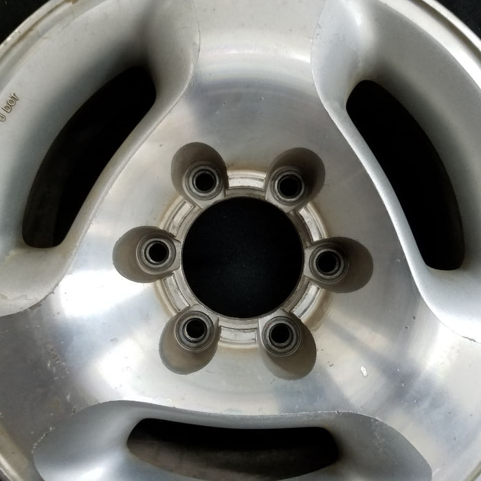 16" INFINITI QX4 97-00 16x7 3 slot Original OEM Wheel Rim - Angle View