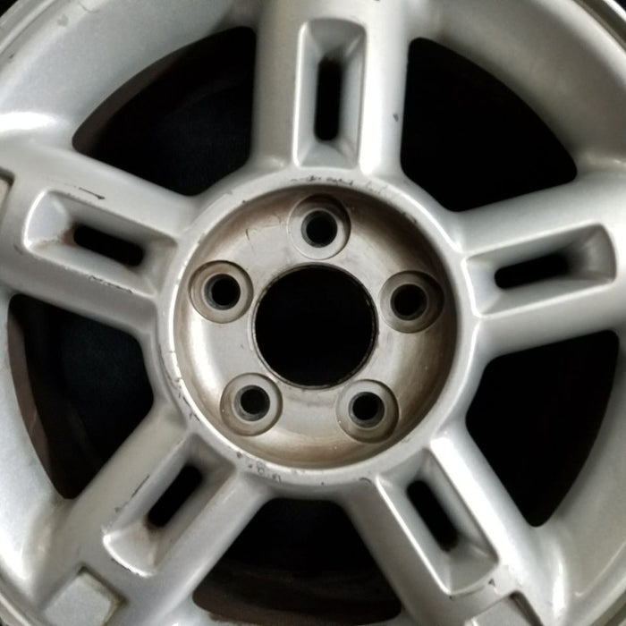 16" EXPLORER 02-03 4 Dr exc. Sport Trac; 16x7 aluminum 5 double spokes w/openings in spokes sparkle silver finish Original OEM Wheel Rim