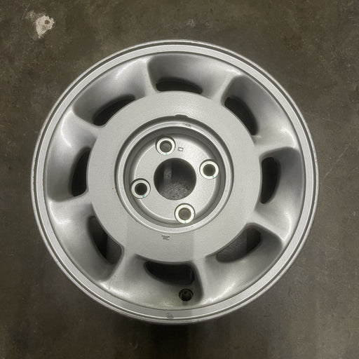 15" INFINITI M30 90-92 15x6.5 , L. Original OEM Wheel Rim - Angle View