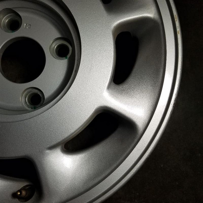 15" INFINITI M30 90-92 15x6.5 , R. Original OEM Wheel Rim - Close-Up Detail
