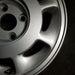 15" INFINITI M30 90-92 15x6.5 , R. Original OEM Wheel Rim - Close-Up Detail