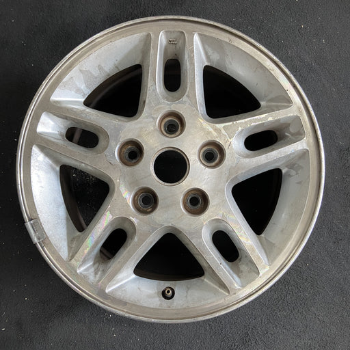 16" GRAND CHEROKEE 99-00 16x7, aluminum, 5 large triangular holes Original OEM - Angle View