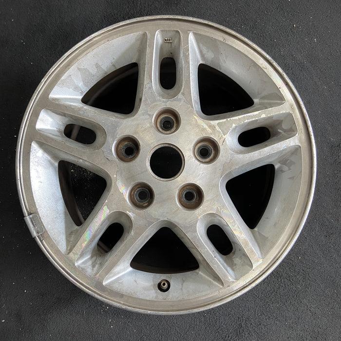 16" GRAND CHEROKEE 99-00 16x7, aluminum, 5 large triangular holes Original OEM - Angle View